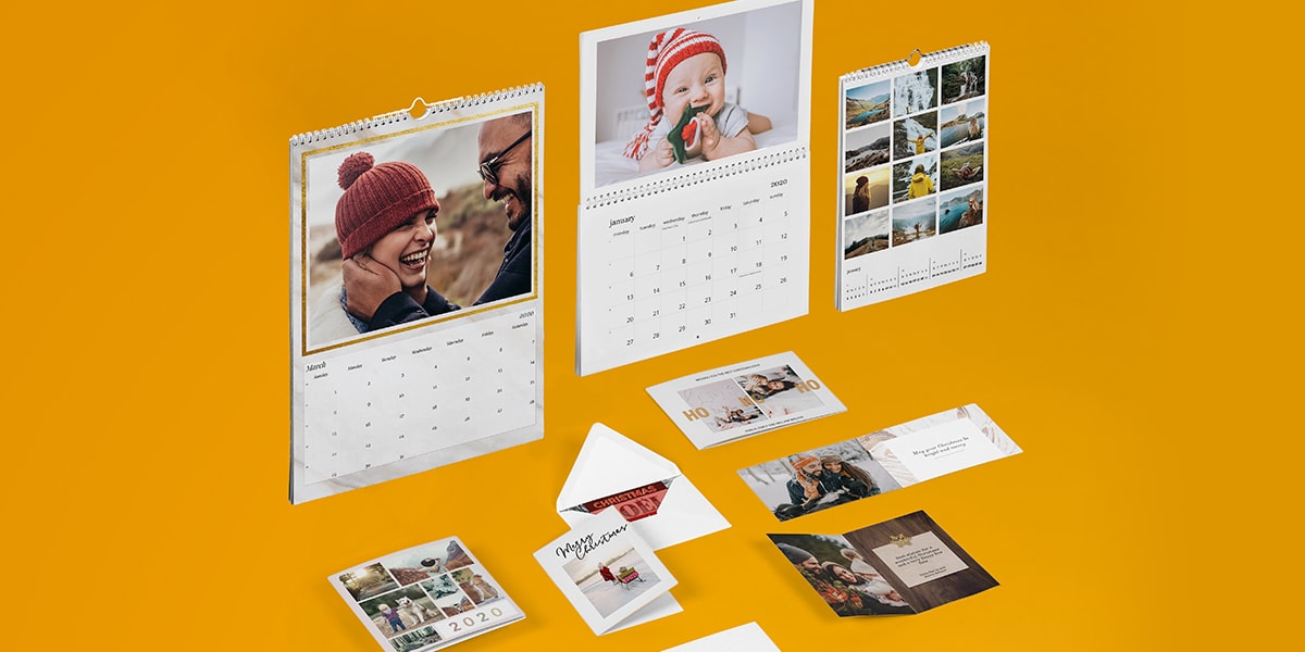 A collection of personalised photo cards and personalised photo calendars against a bright yellow background with darker yellow swirls on the background.